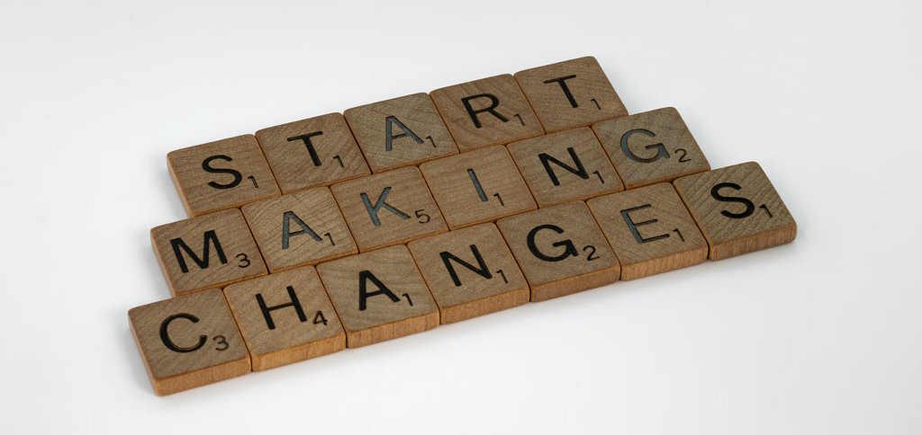 Scrabble tiles spelling 'Start Making Changes'